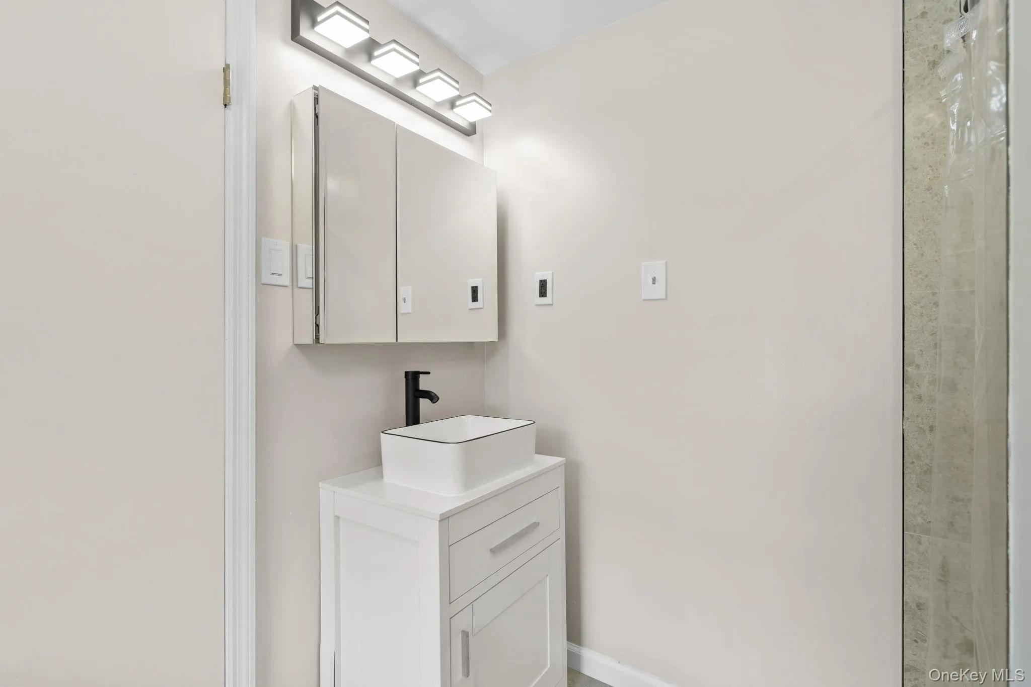Bathroom featuring vanity Bathroom featuring vanity