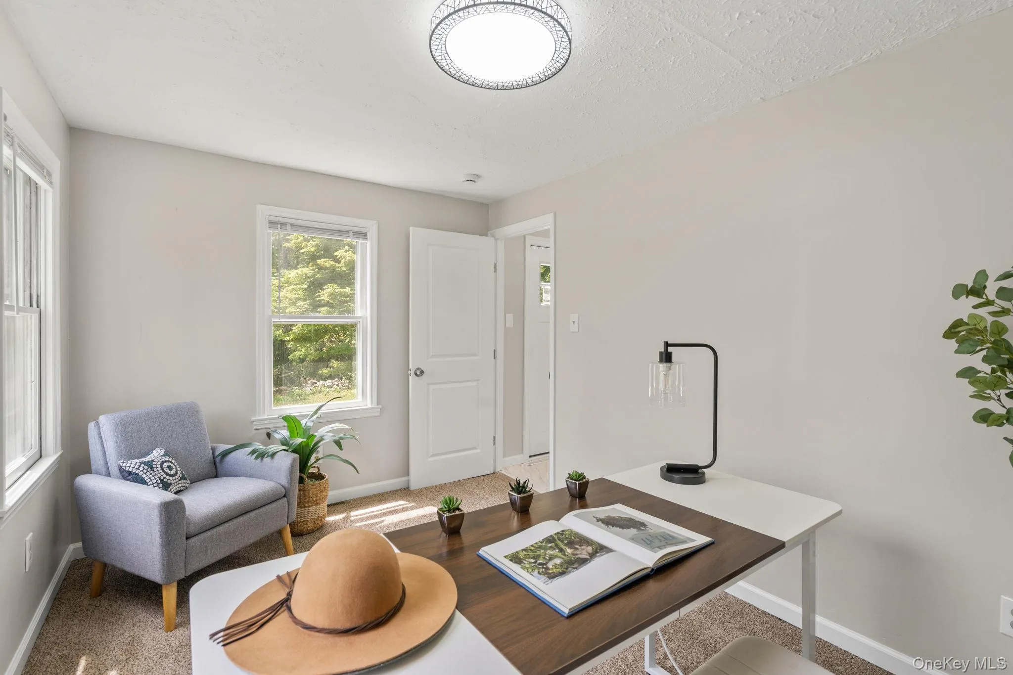 Home office with carpet and baseboards Home office with carpet and baseboards