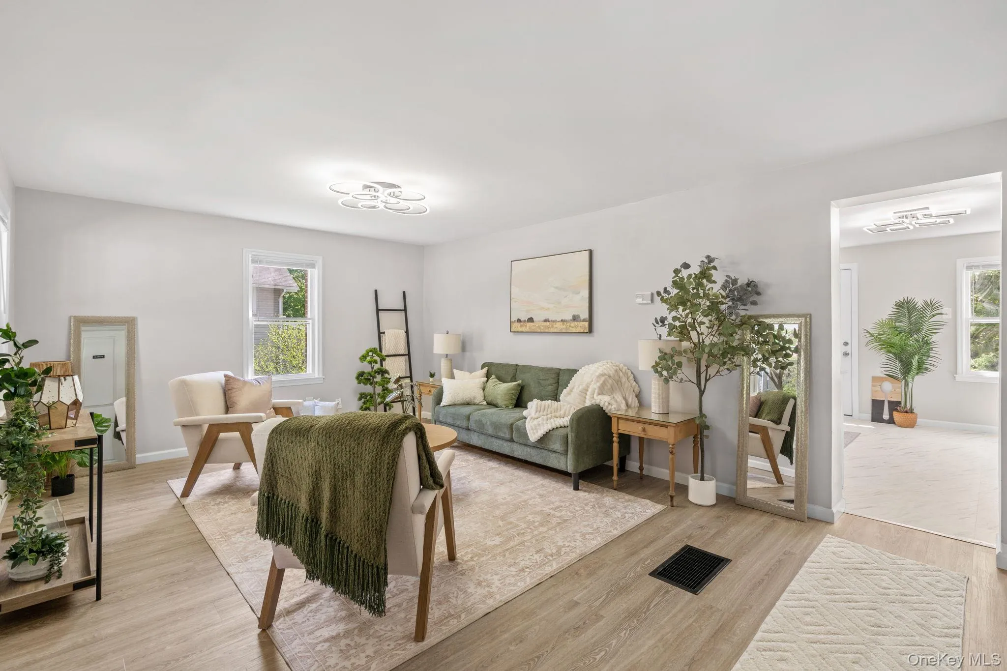 Living area with light wood-style floors Living area with light wood-style floors