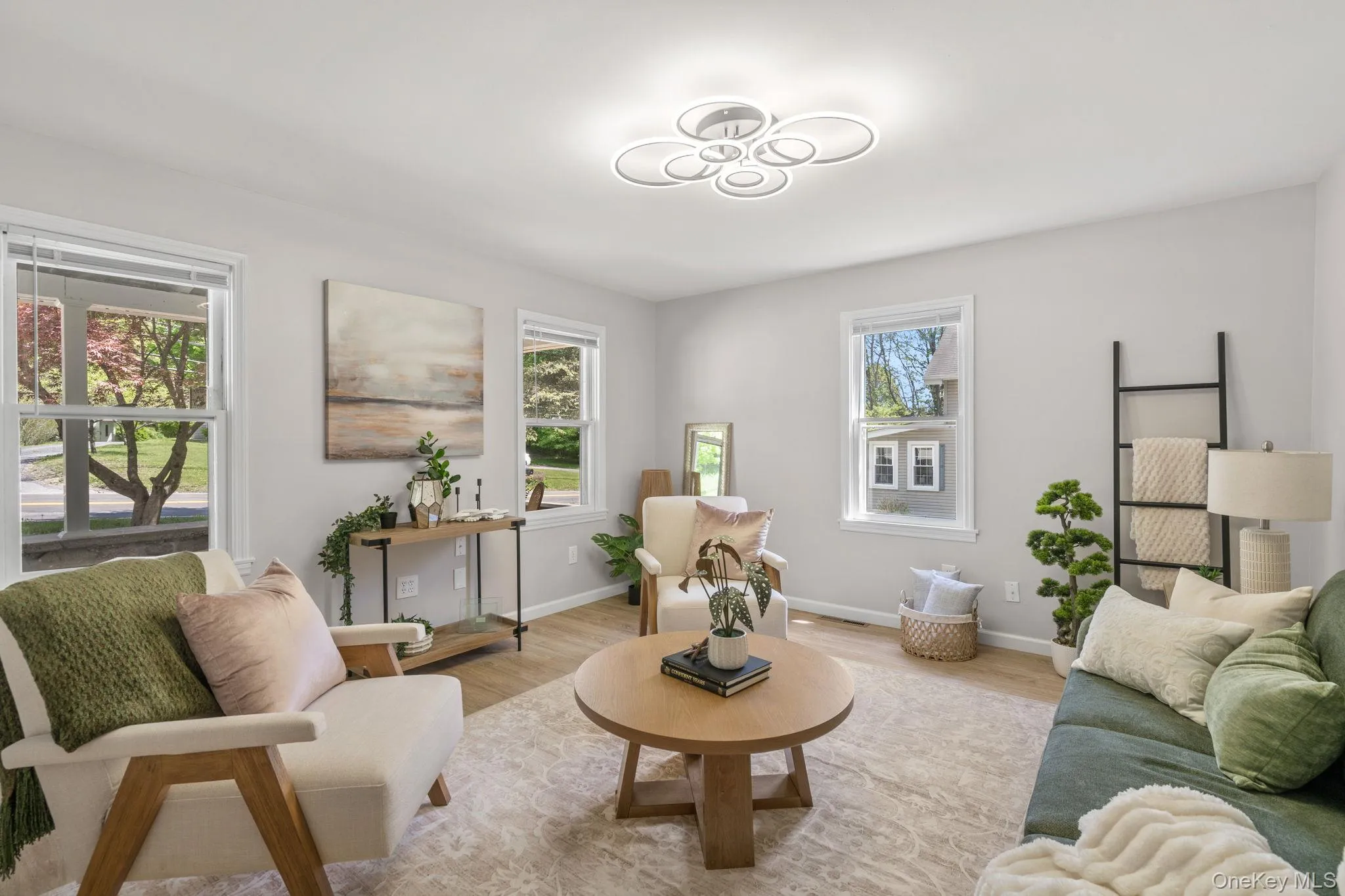 Sitting room with wood finished floors and baseboards Sitting room with wood finished floors and baseboards