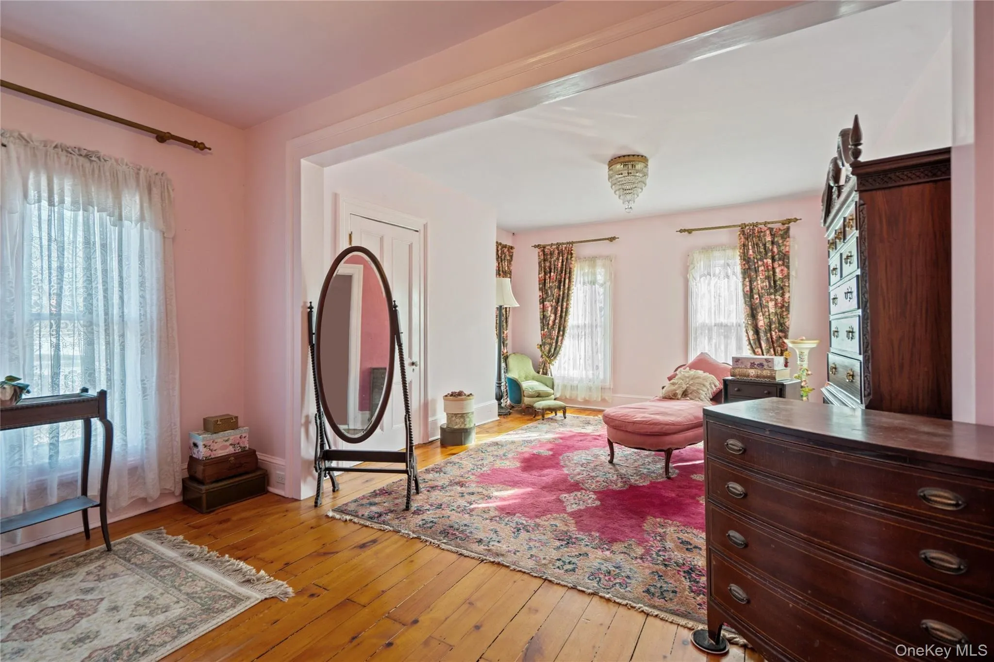 Entryway featuring light wood-style floors and baseboards Entryway featuring light wood-style floors and baseboards