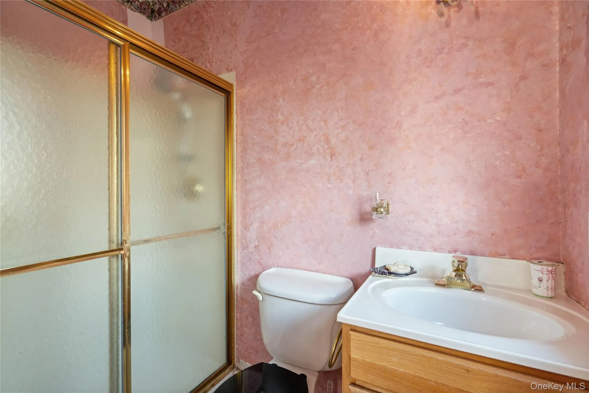 Full bath with vanity and a shower with shower door Full bath with vanity and a shower with shower door