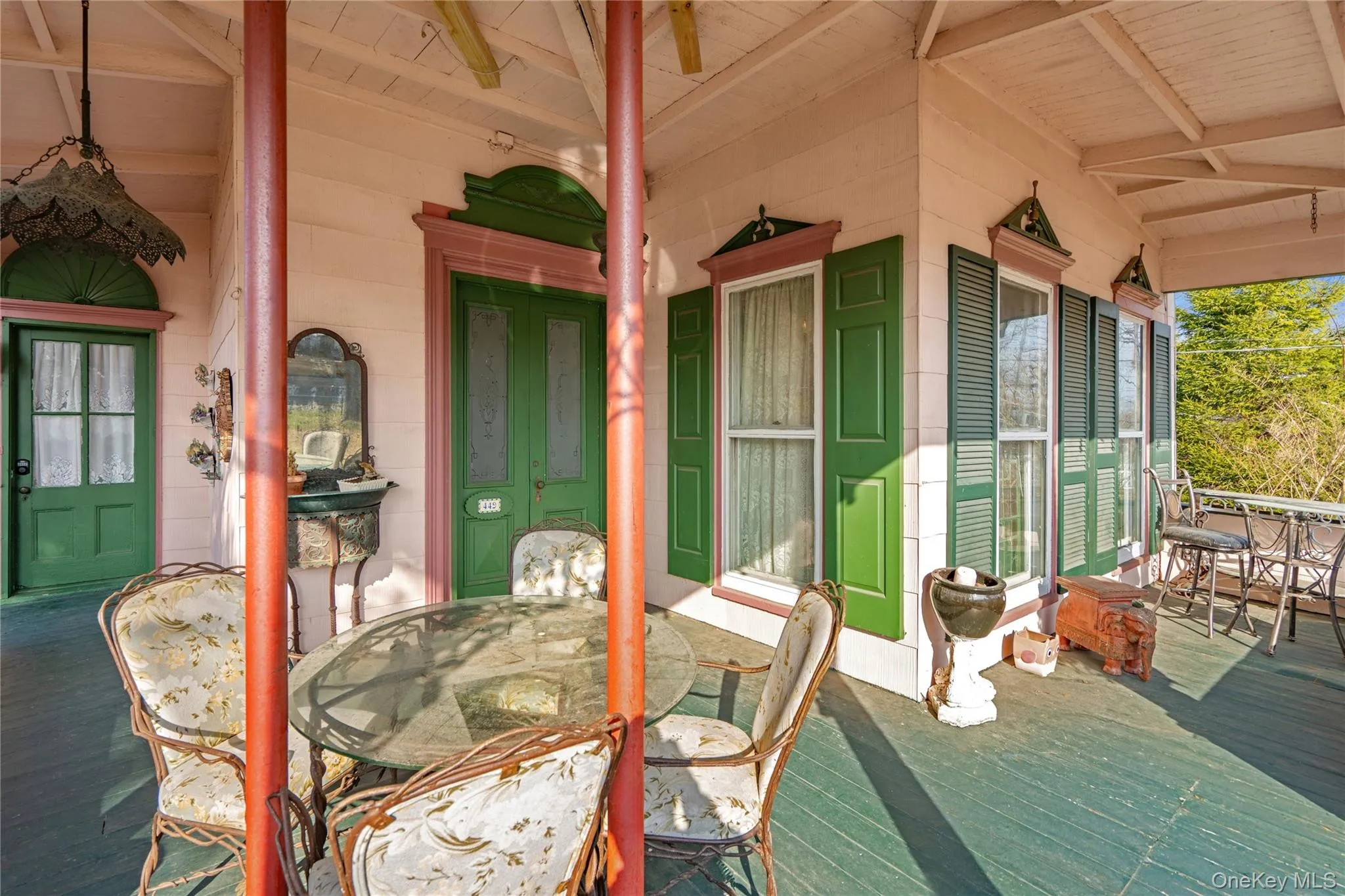 Wooden porch with outdoor dining area Wooden porch with outdoor dining area