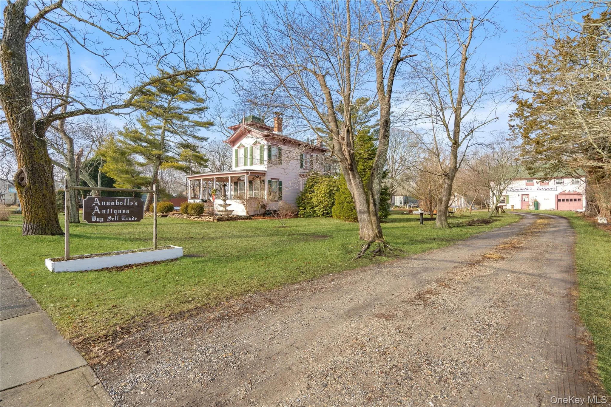 View of front of property with a chimney and a front lawn View of front of property with a chimney and a front lawn