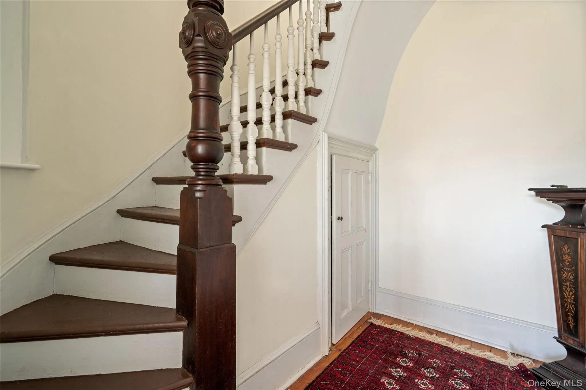 Stairs with wood finished floors and baseboards Stairs with wood finished floors and baseboards