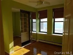 Unfurnished room featuring baseboard heating Unfurnished room featuring baseboard heating