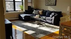 Living room featuring baseboard heating Living room featuring baseboard heating