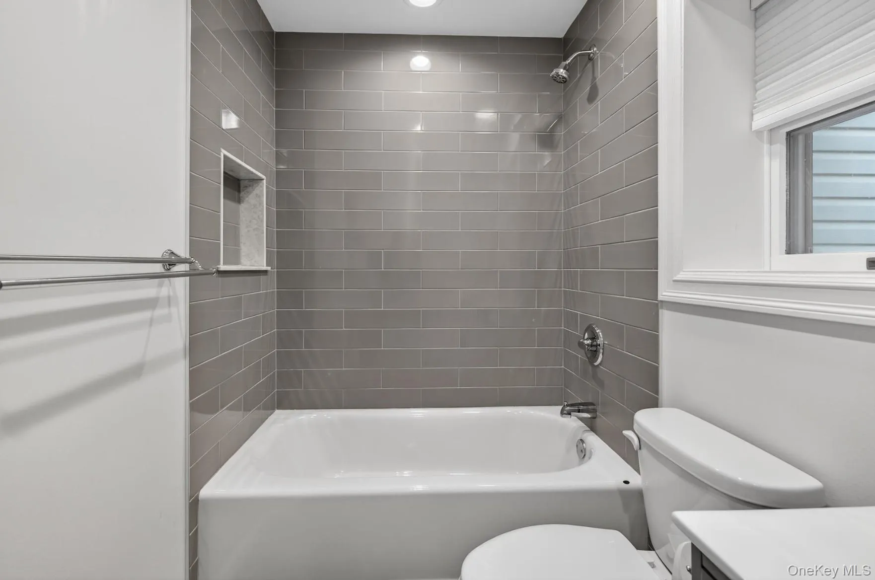 Full bathroom featuring vanity and tub / shower combination Full bathroom featuring vanity and tub / shower combination