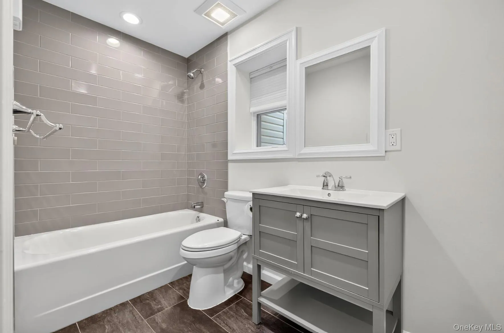 Full bathroom with shower / bath combination and vanity Full bathroom with shower / bath combination and vanity