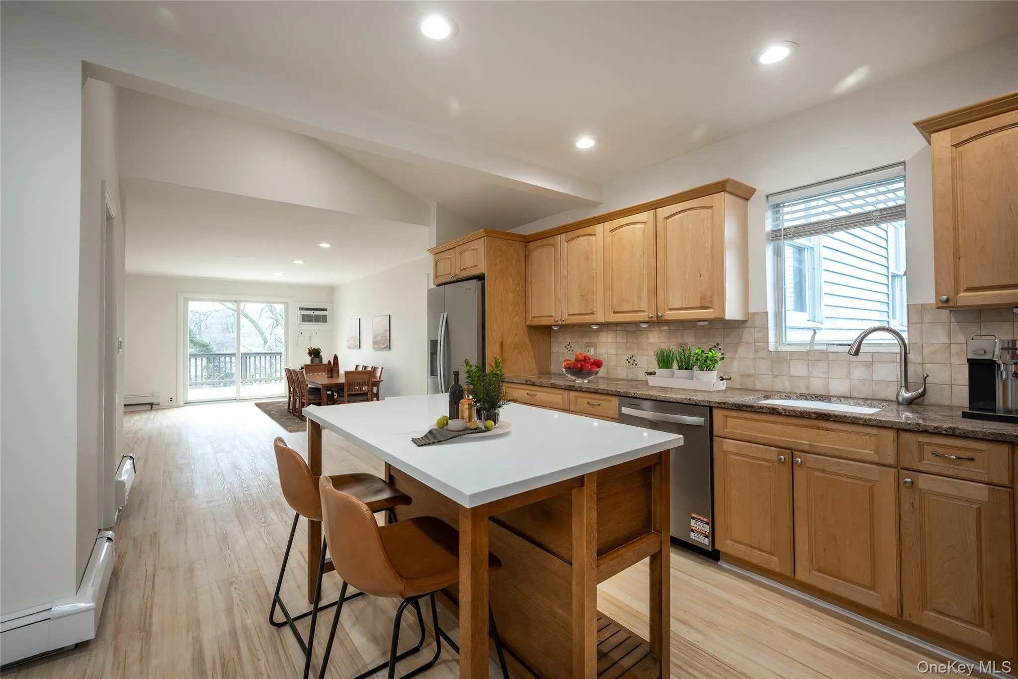 Kitchen with New Appliances. Open to the Family Room/Dining Area. Virtually Staged Kitchen with New Appliances. Open to the Family Room/Dining Area. Virtually Staged