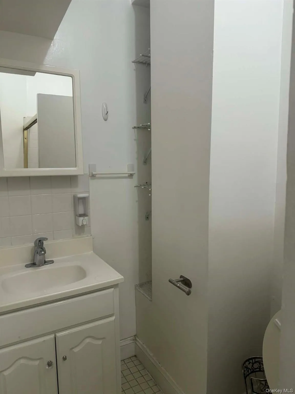 Half bath with decorative backsplash and vanity Half bath with decorative backsplash and vanity