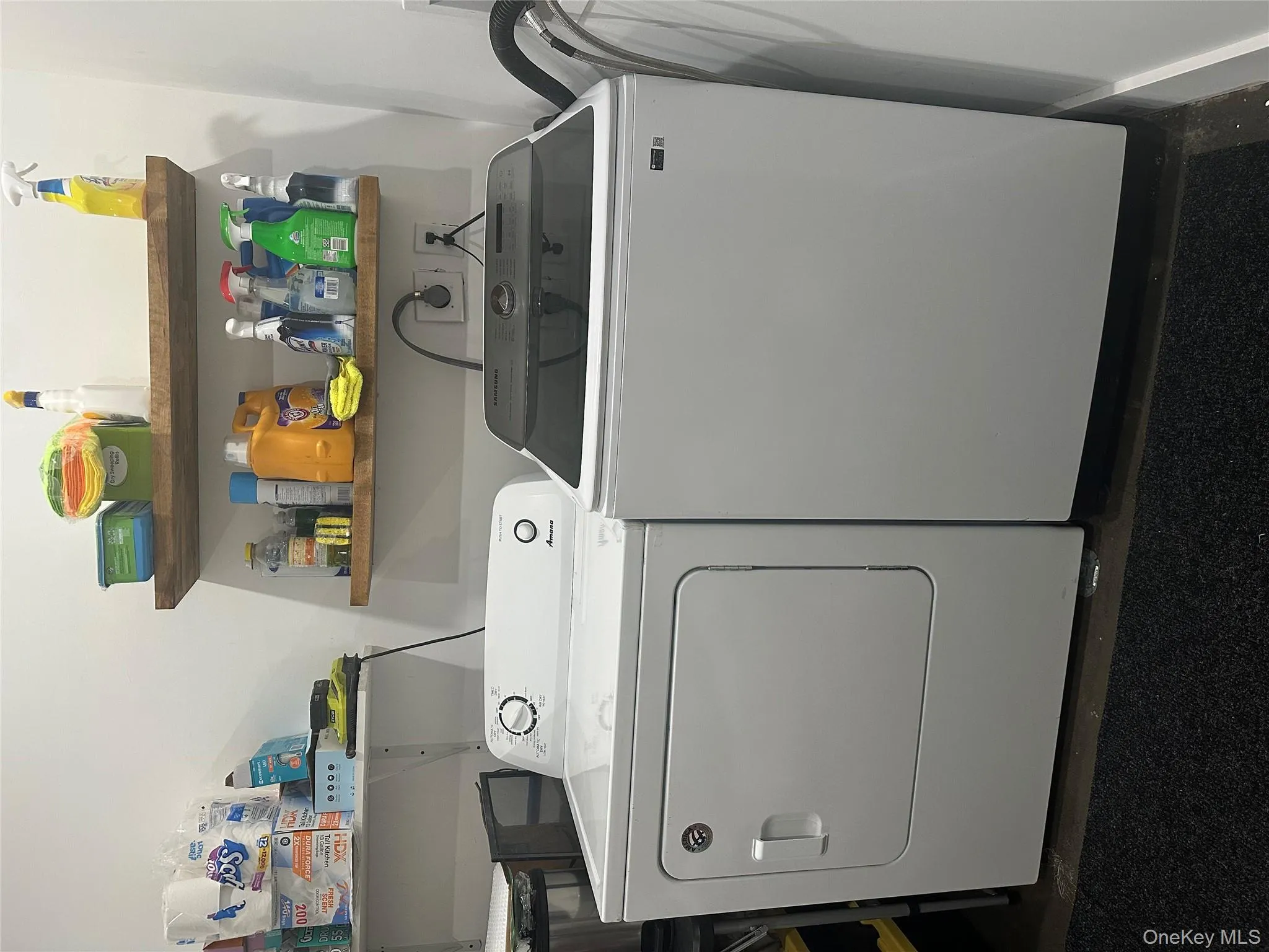 Laundry room featuring washing machine and clothes dryer Laundry room featuring washing machine and clothes dryer