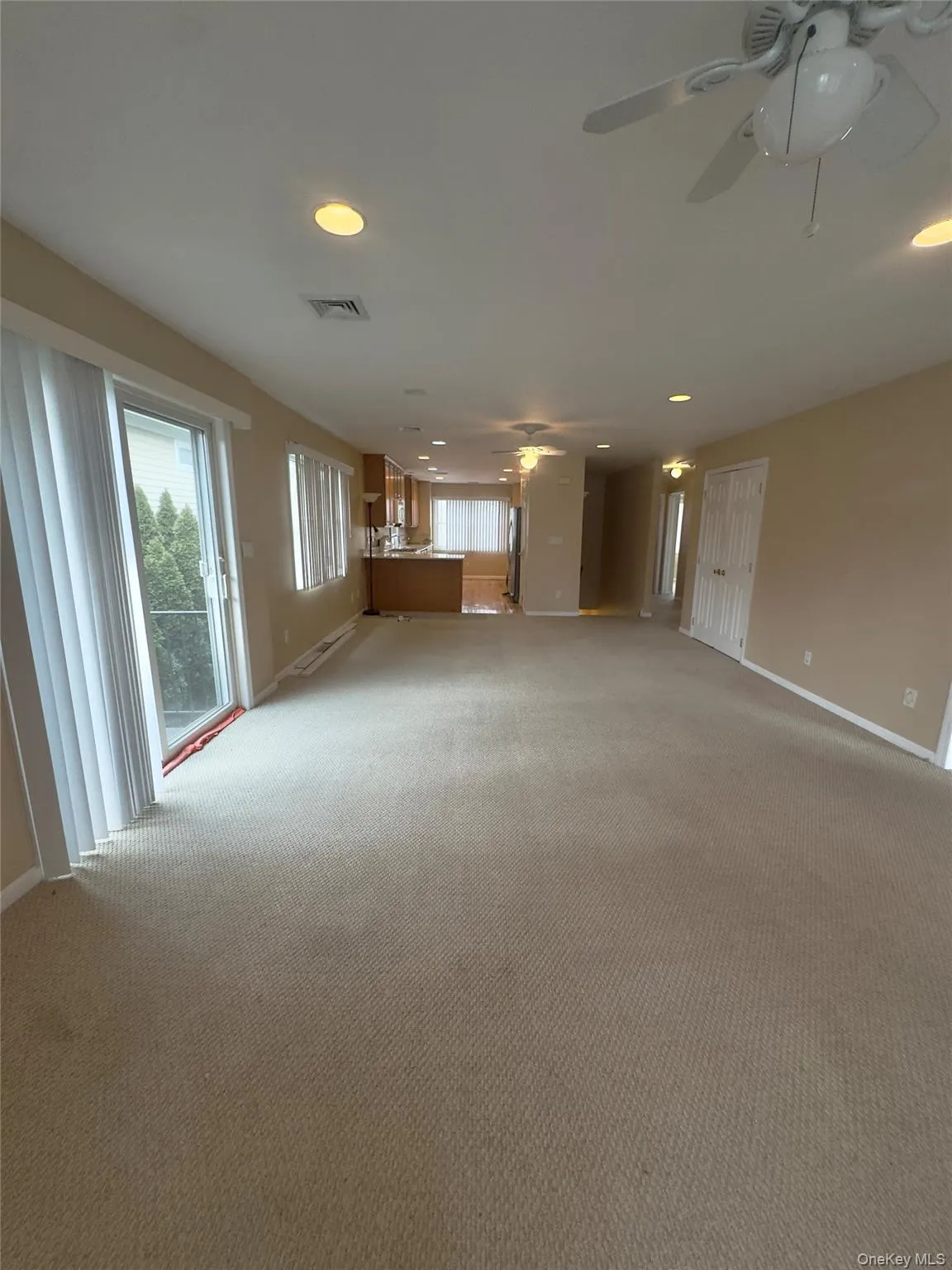 Unfurnished living room with recessed lighting and carpet flooring Unfurnished living room with recessed lighting and carpet flooring