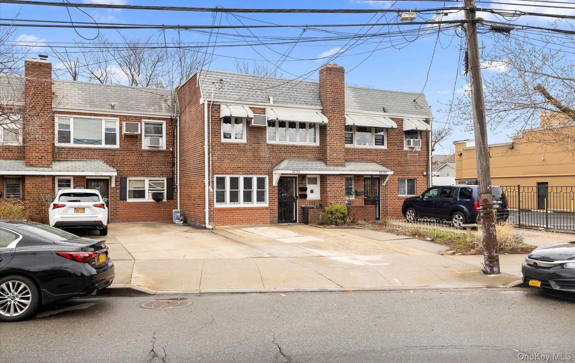 Traditional-style house with a chimney and brick siding Traditional-style house with a chimney and brick siding