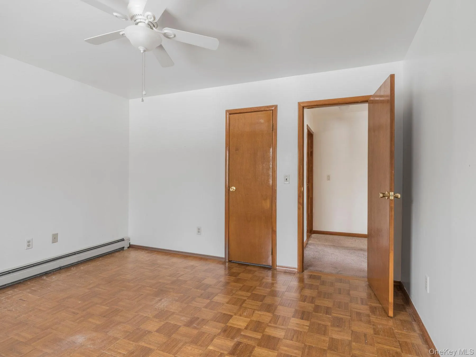 Spare room with baseboards and ceiling fan Spare room with baseboards and ceiling fan