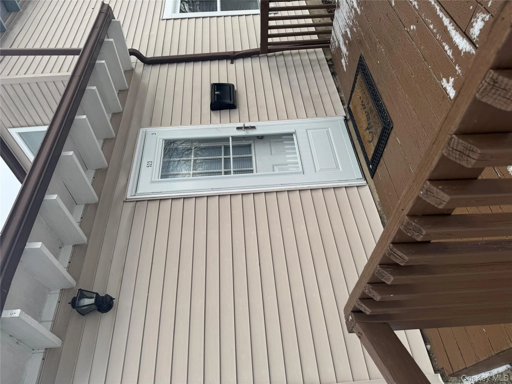 Doorway to property with a wooden deck Doorway to property with a wooden deck