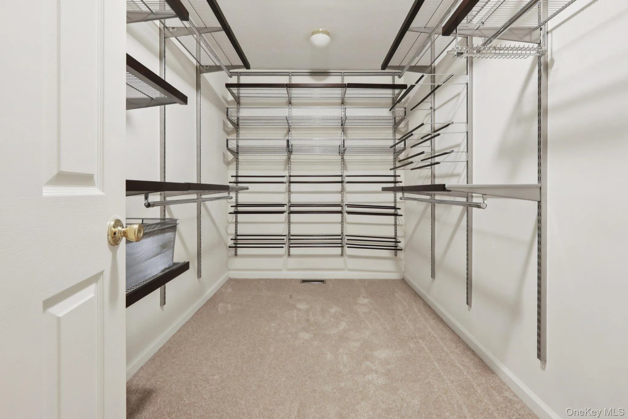 Walk in closet with light carpet Walk in closet with light carpet