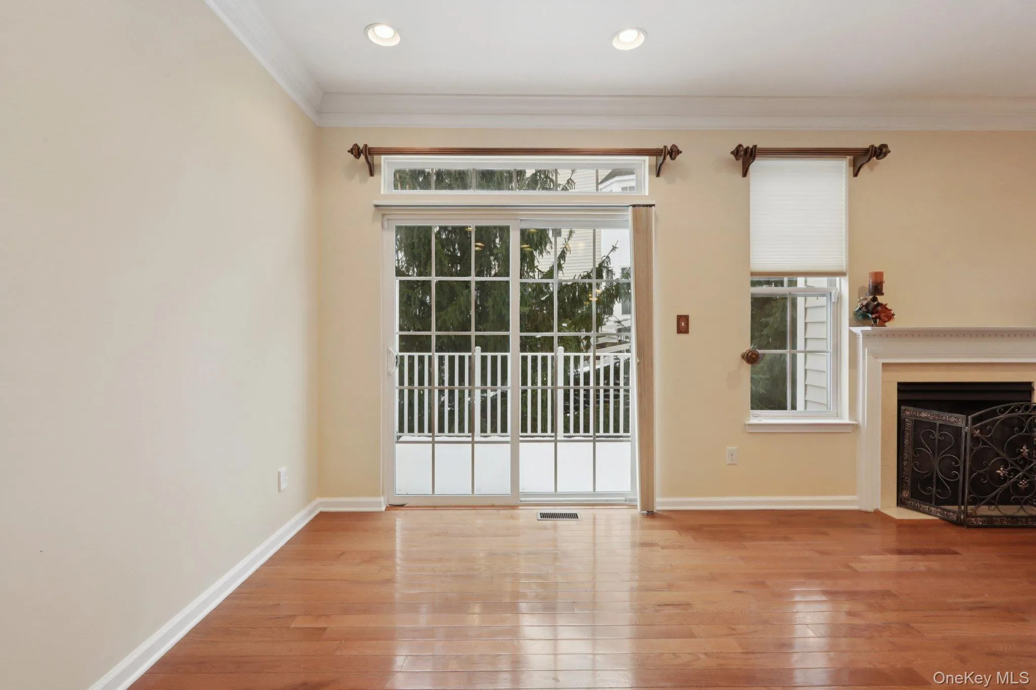 Dining Area featuring crown molding, a fireplace with flush hearth, light wood-style flooring, and recessed lighting Dining Area featuring crown molding, a fireplace with flush hearth, light wood-style flooring, and recessed lighting