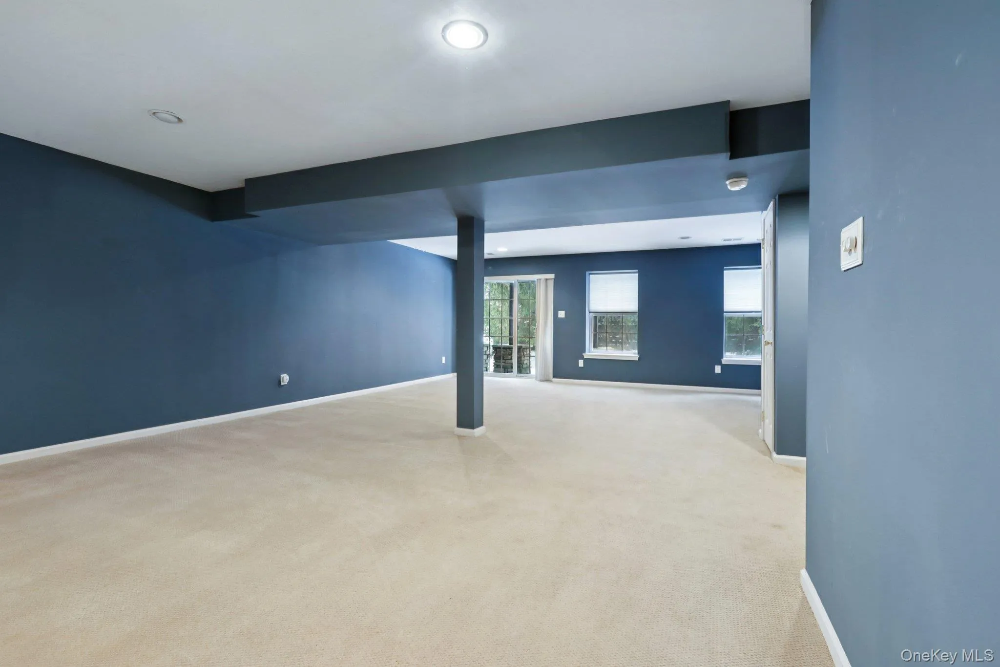 Empty room with carpet floors and recessed lighting Empty room with carpet floors and recessed lighting