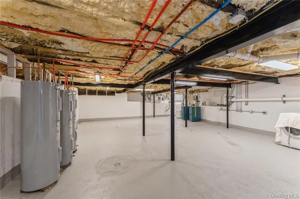 Unfinished basement with water heater Unfinished basement with water heater