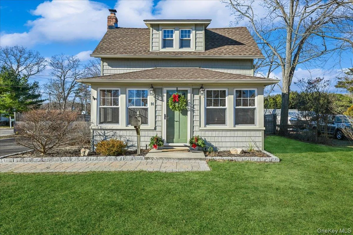 American foursquare style home with roof with shingles and a chimney American foursquare style home with roof with shingles and a chimney