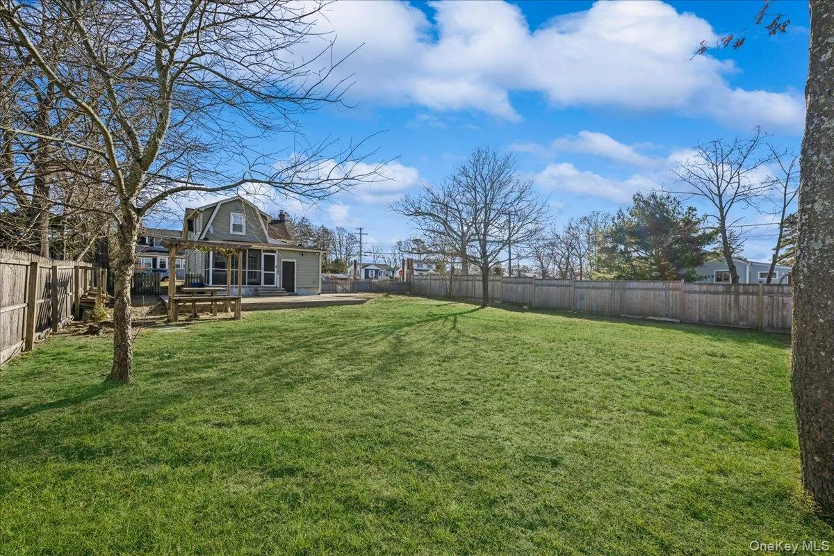 Fenced backyard featuring a patio area Fenced backyard featuring a patio area