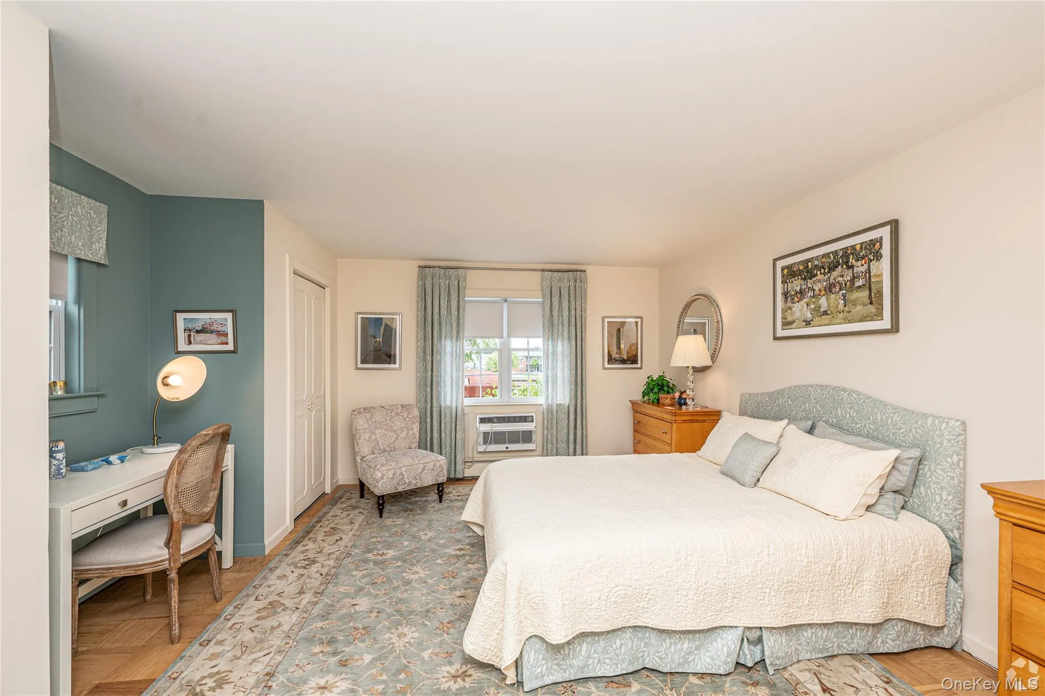 Bedroom featuring an office area and a closet Bedroom featuring an office area and a closet