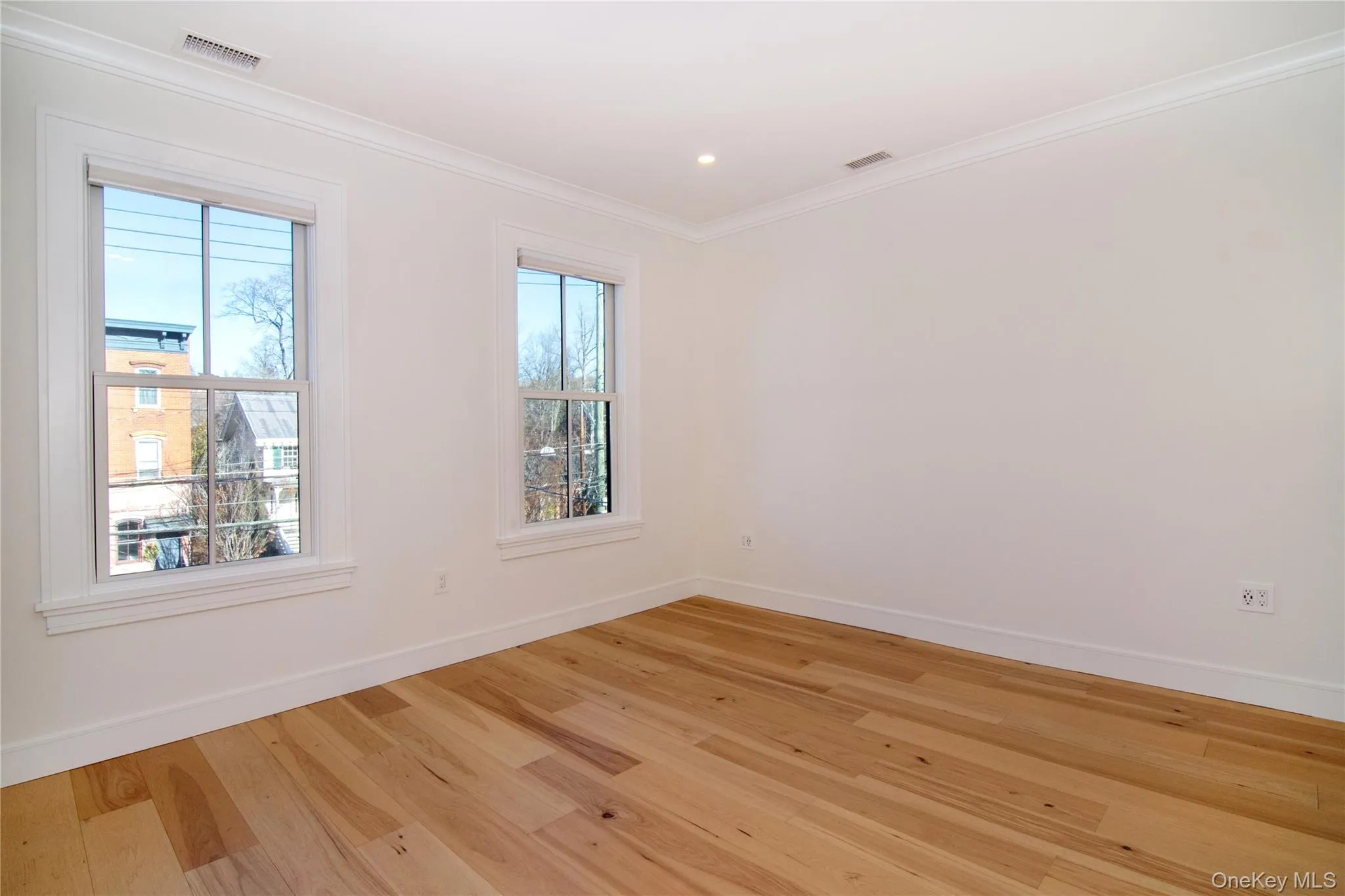 The primary bedroom offers a peaceful retreat, featuring soft natural light and a spacious layout The primary bedroom offers a peaceful retreat, featuring soft natural light and a spacious layout