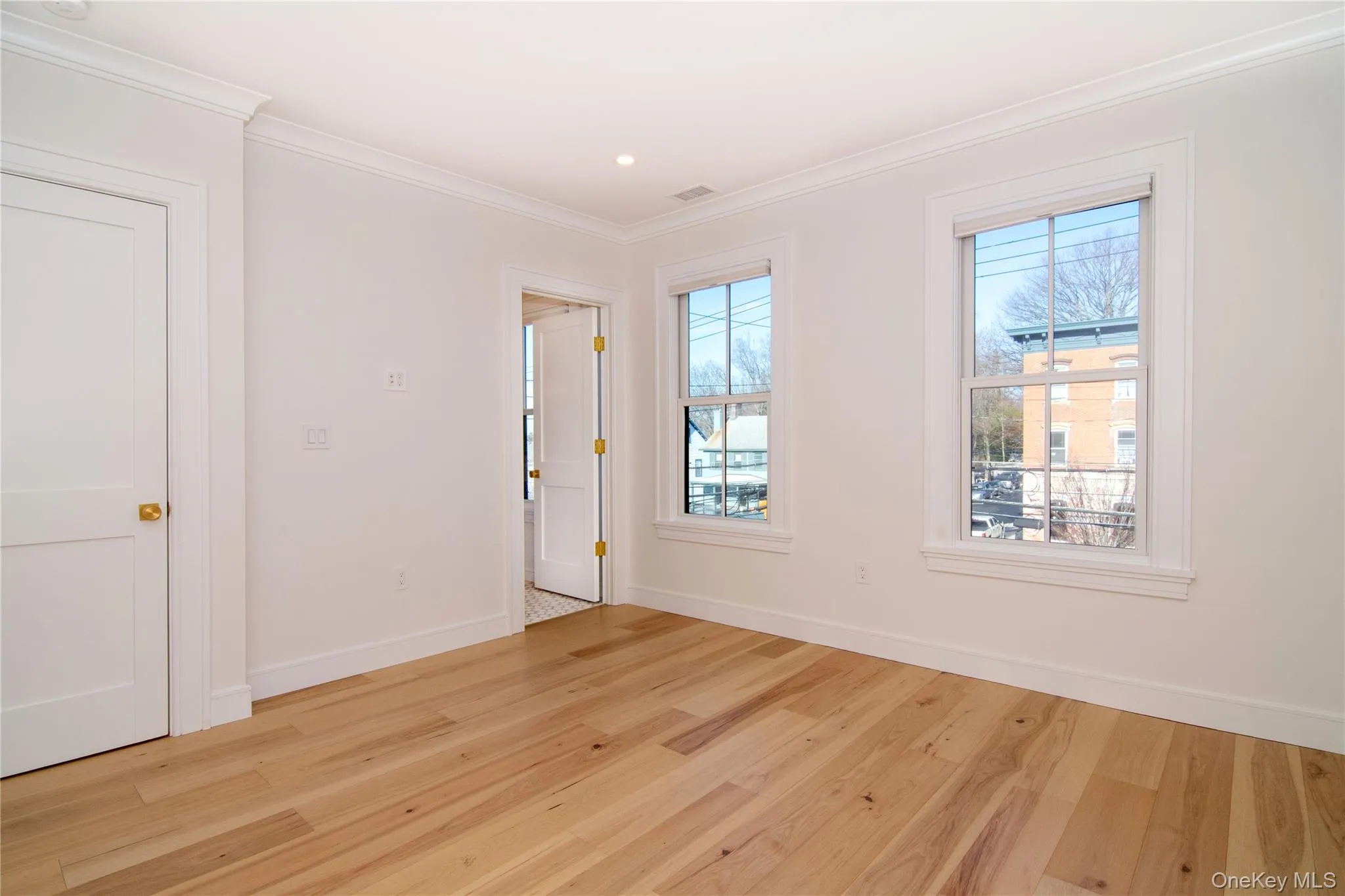 Primary bedroom featuring ornamental molding, and recessed lighting Primary bedroom featuring ornamental molding, and recessed lighting