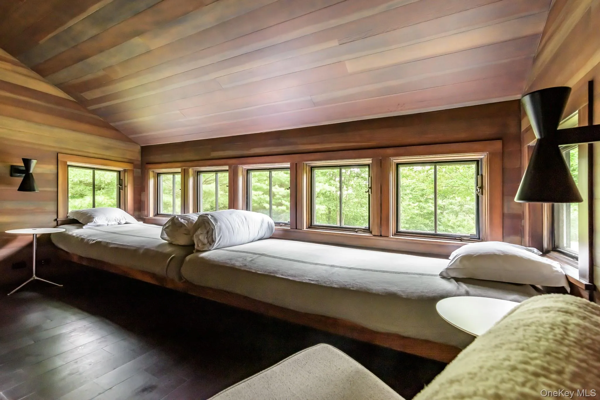 Bedroom featuring wood ceiling, vaulted ceiling, wood walls, and hardwood / wood-style flooring Bedroom featuring wood ceiling, vaulted ceiling, wood walls, and hardwood / wood-style flooring