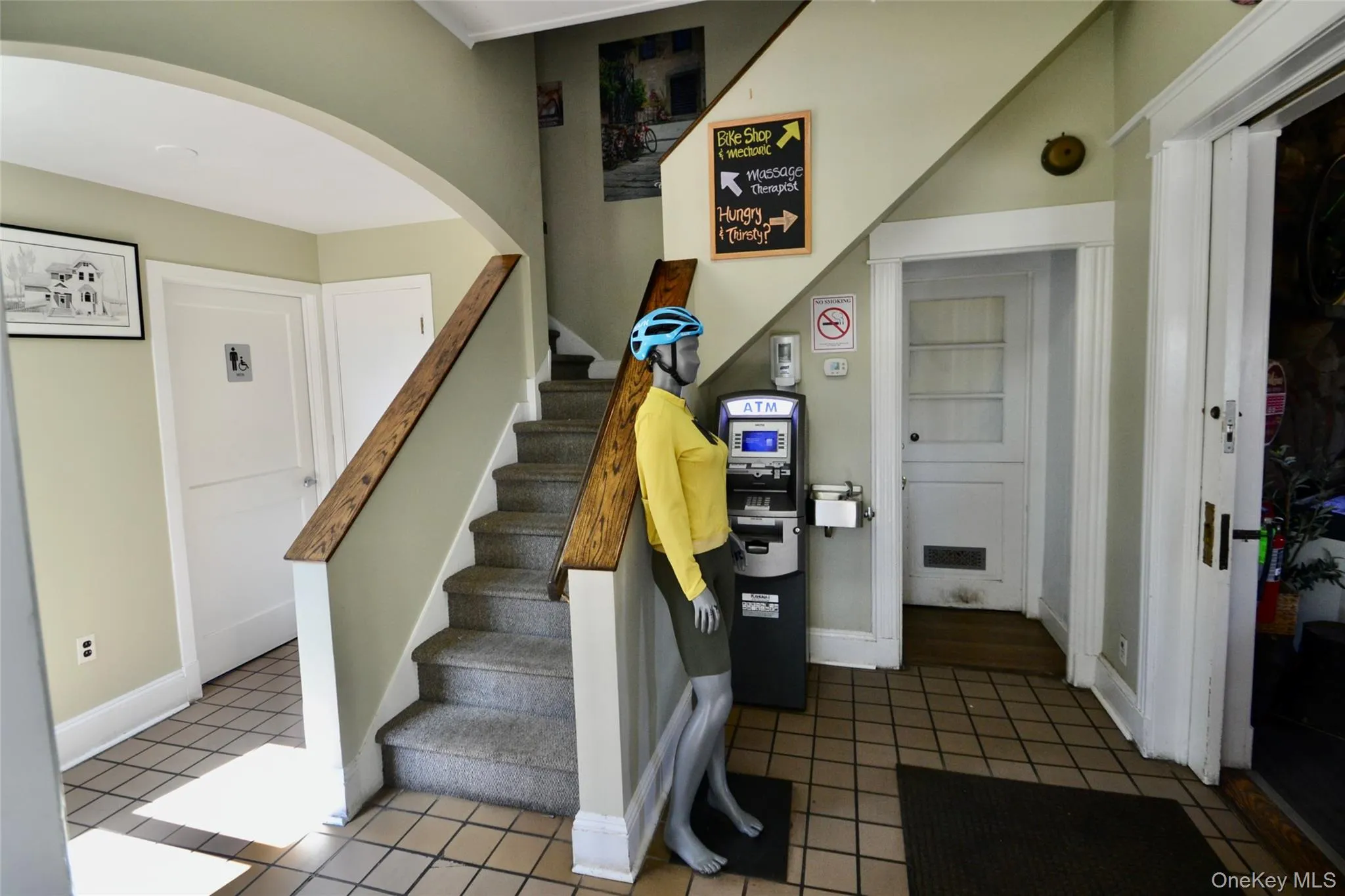 Stairway featuring tile patterned flooring and arched walkways Stairway featuring tile patterned flooring and arched walkways