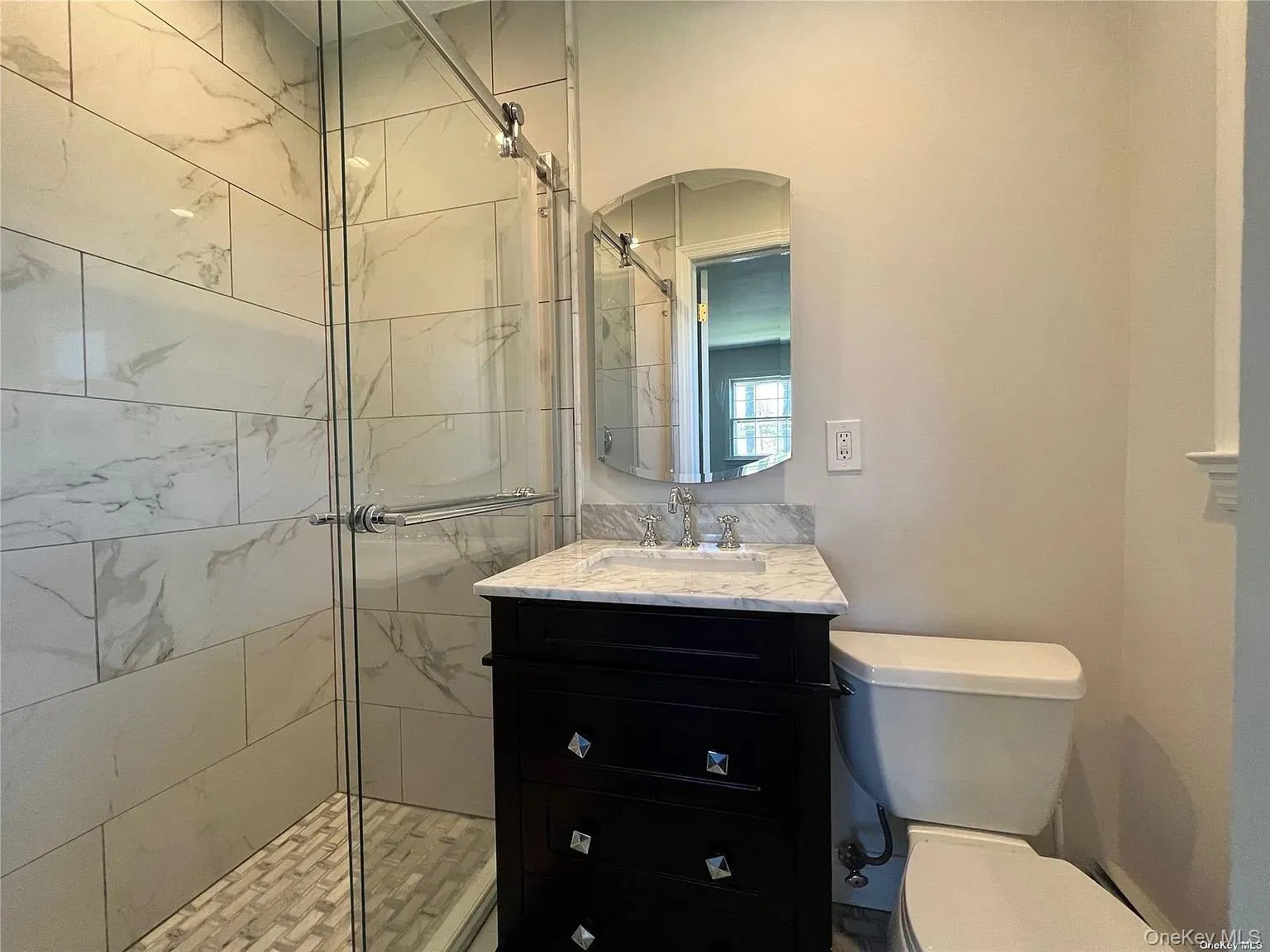 Bathroom with a shower stall and vanity Bathroom with a shower stall and vanity
