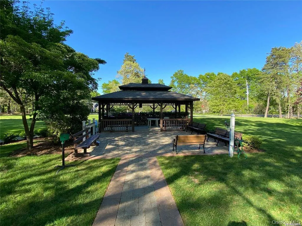 View of home's community featuring a lawn, a patio, and a gazebo View of home's community featuring a lawn, a patio, and a gazebo