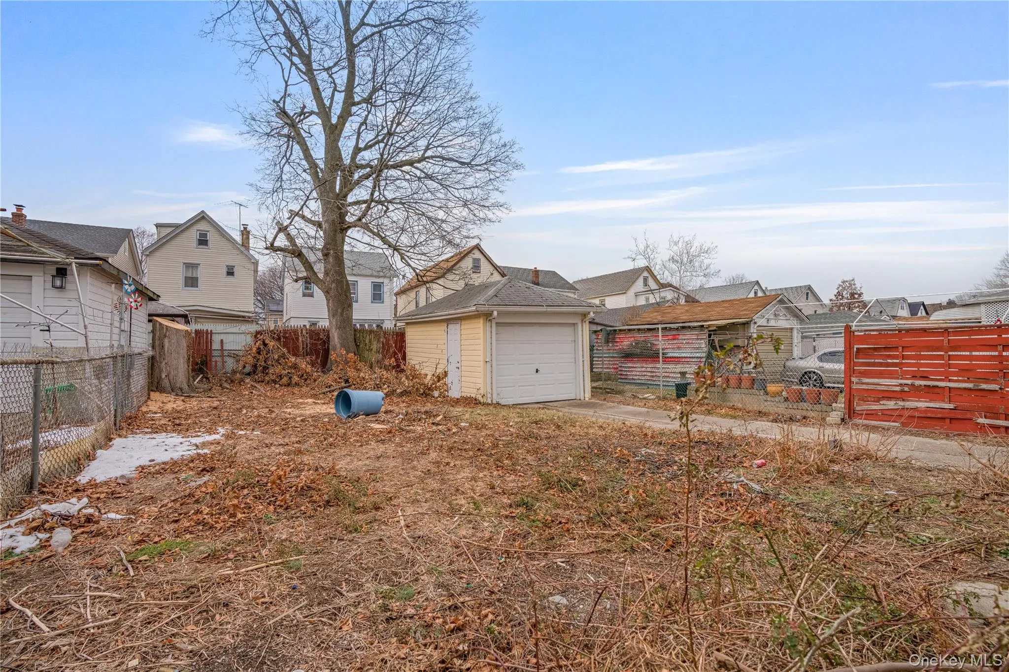 View of yard with a residential view and concrete driveway View of yard with a residential view and concrete driveway