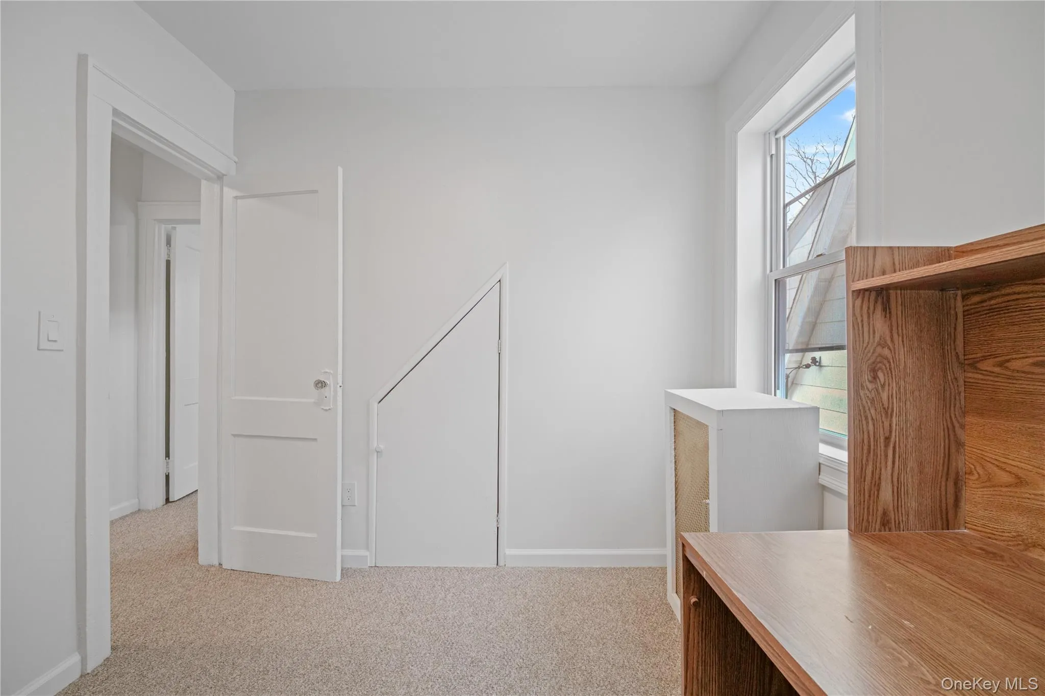 Unfurnished office featuring plenty of natural light and light carpet Unfurnished office featuring plenty of natural light and light carpet