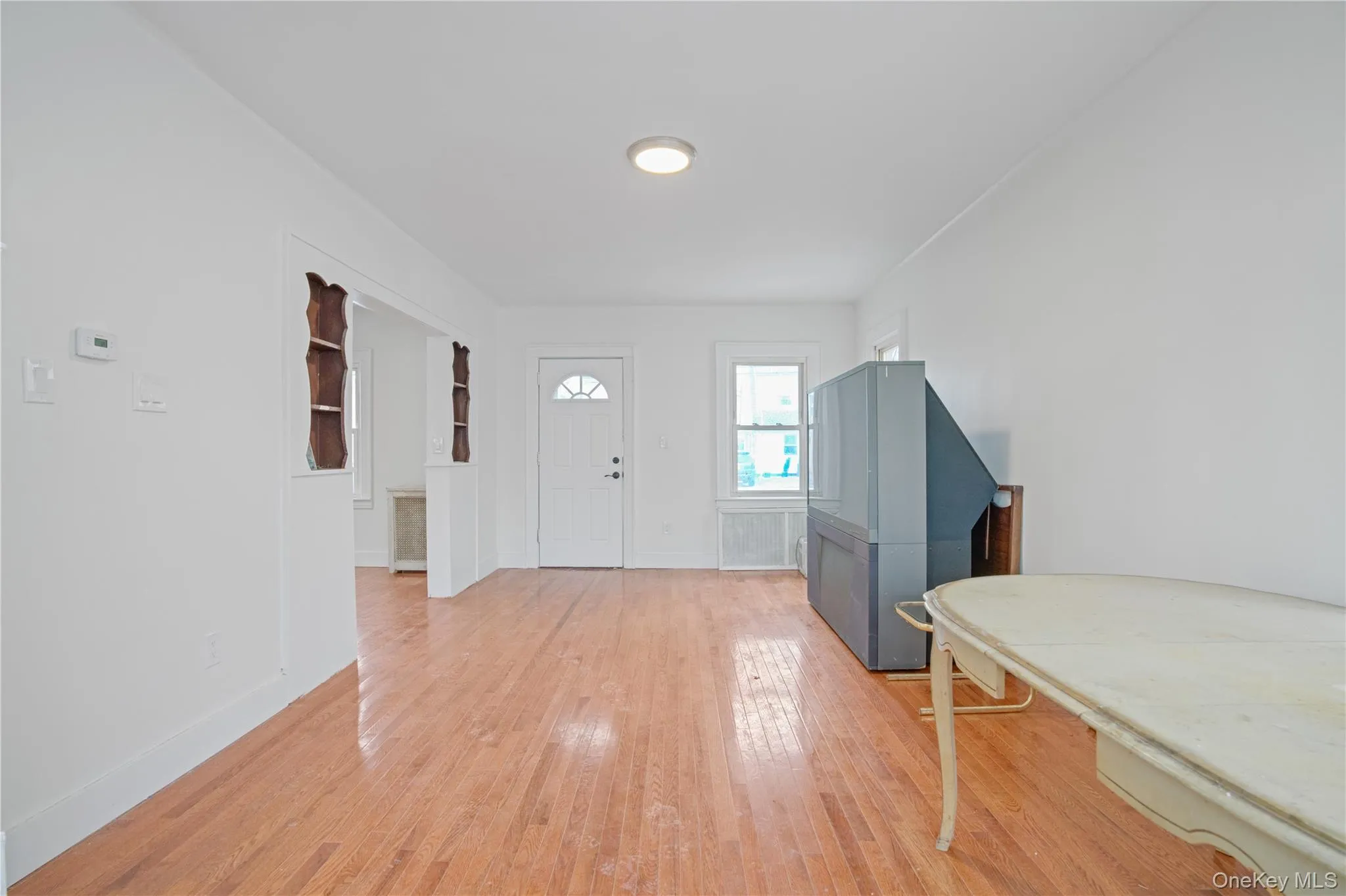 Foyer featuring light wood finished floors and baseboards Foyer featuring light wood finished floors and baseboards