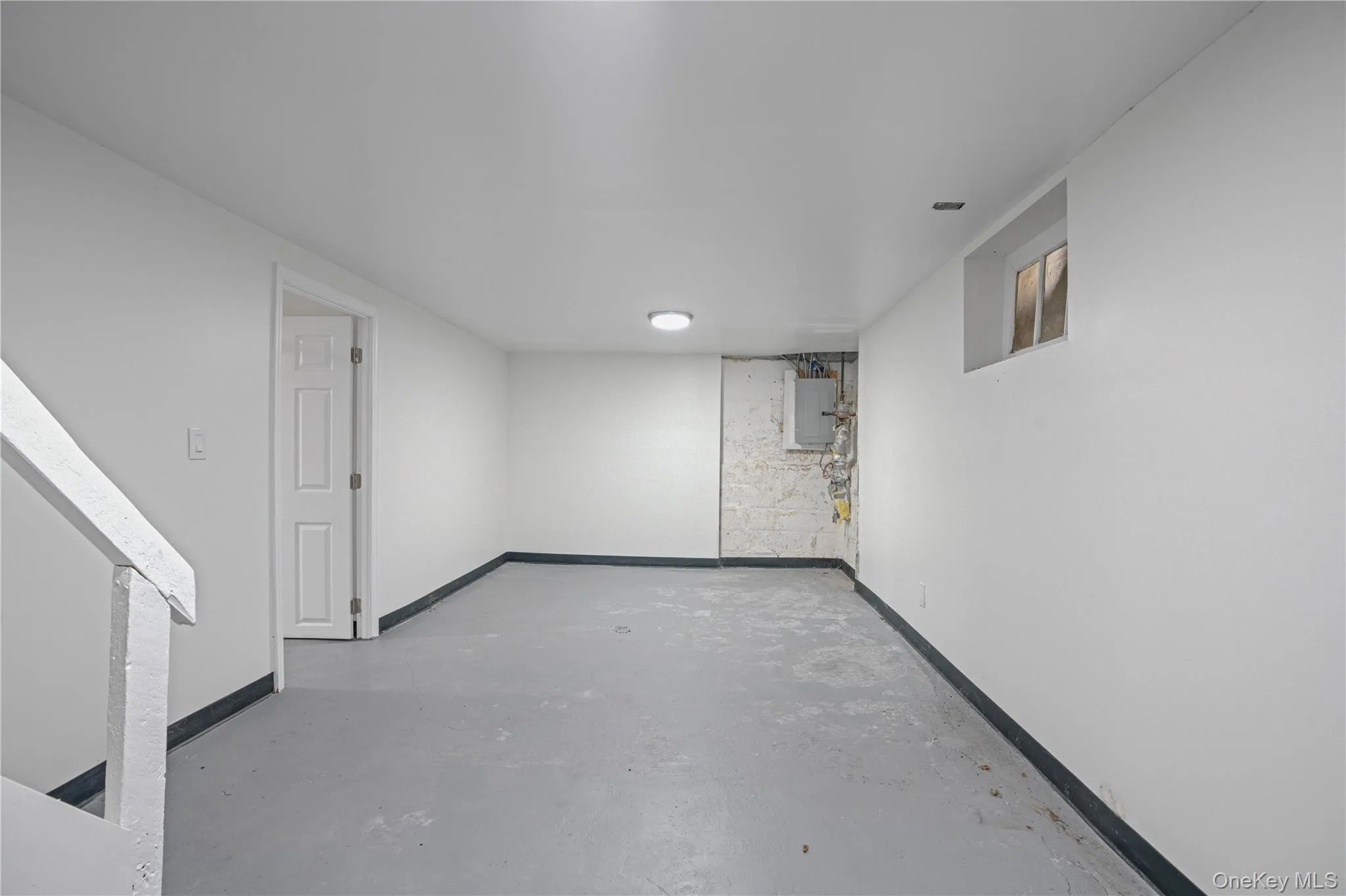 Finished below grade area with baseboards and electric panel Finished below grade area with baseboards and electric panel