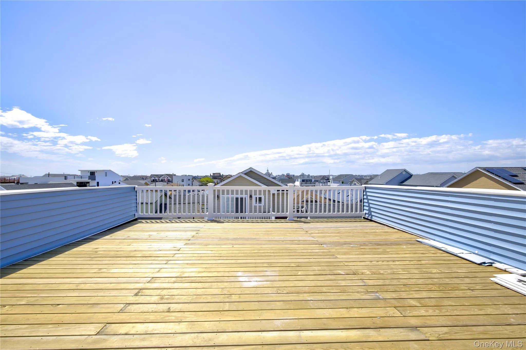 Wooden terrace with a residential view Wooden terrace with a residential view