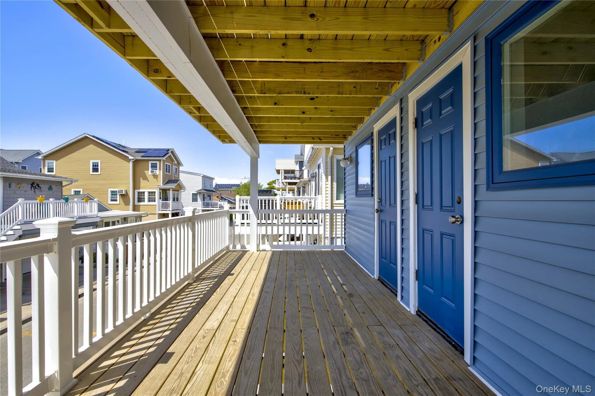Wooden terrace with a residential view Wooden terrace with a residential view