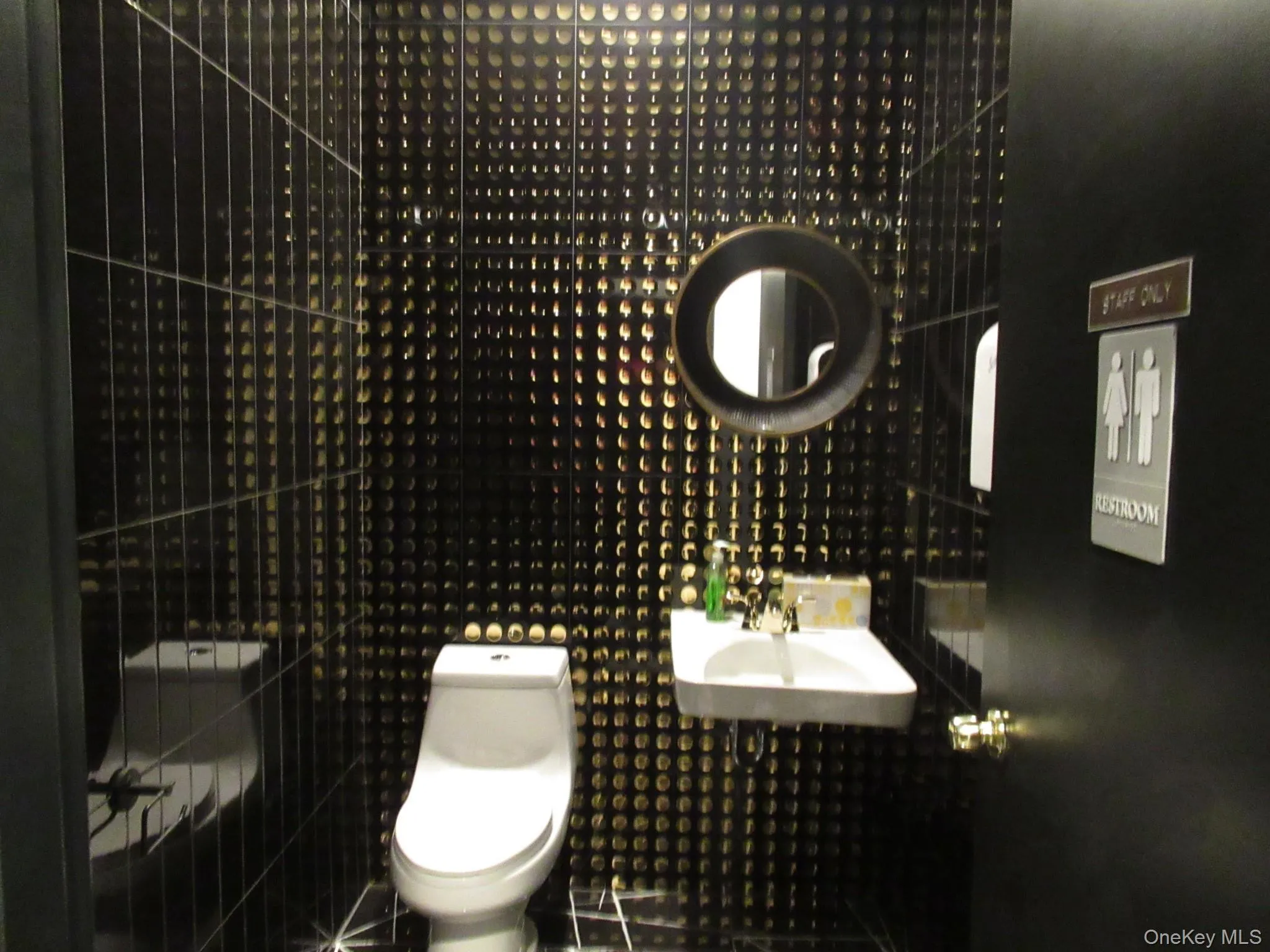 Bathroom featuring a sink and toilet Bathroom featuring a sink and toilet