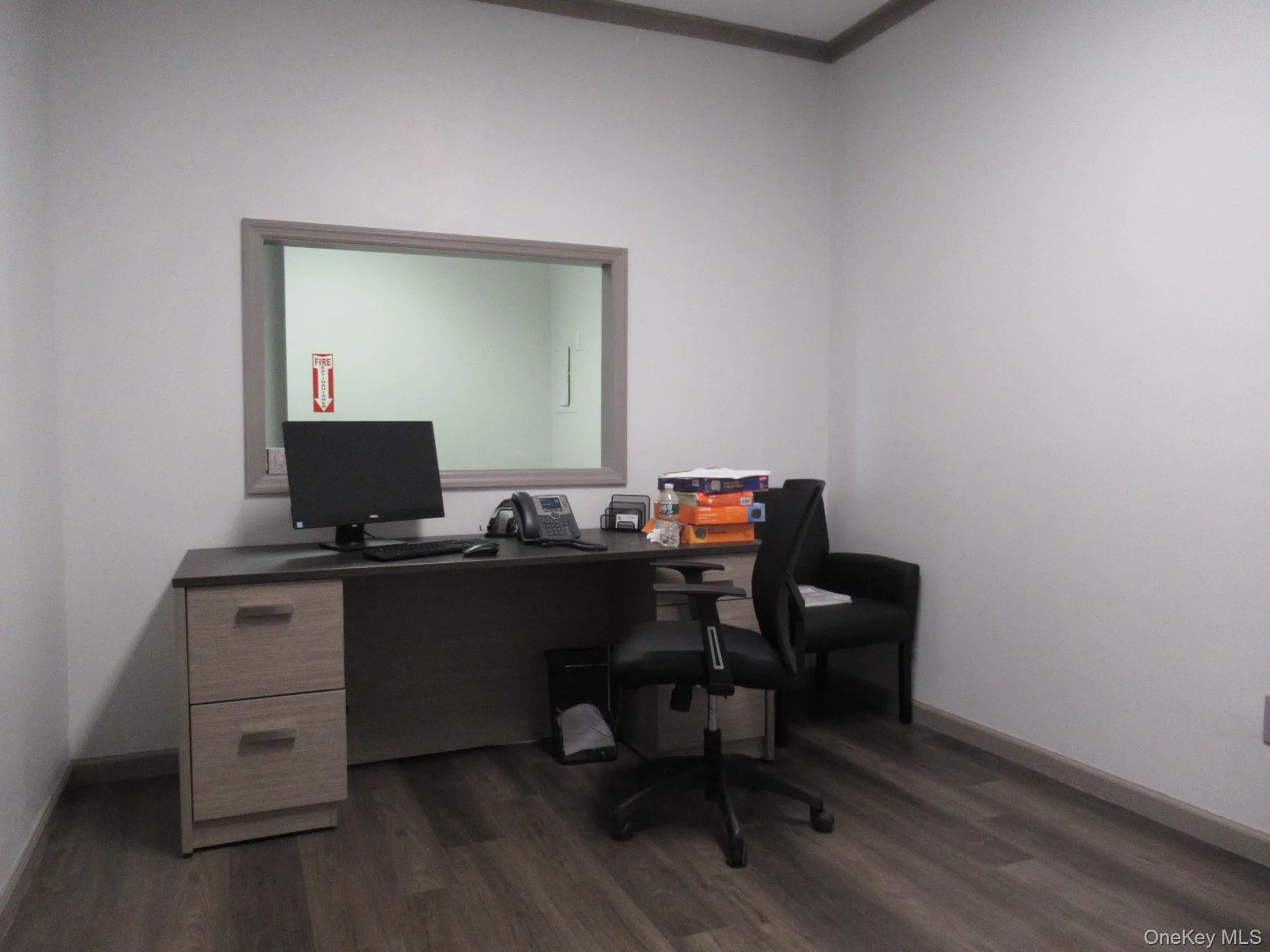 Office with dark wood-style flooring Office with dark wood-style flooring