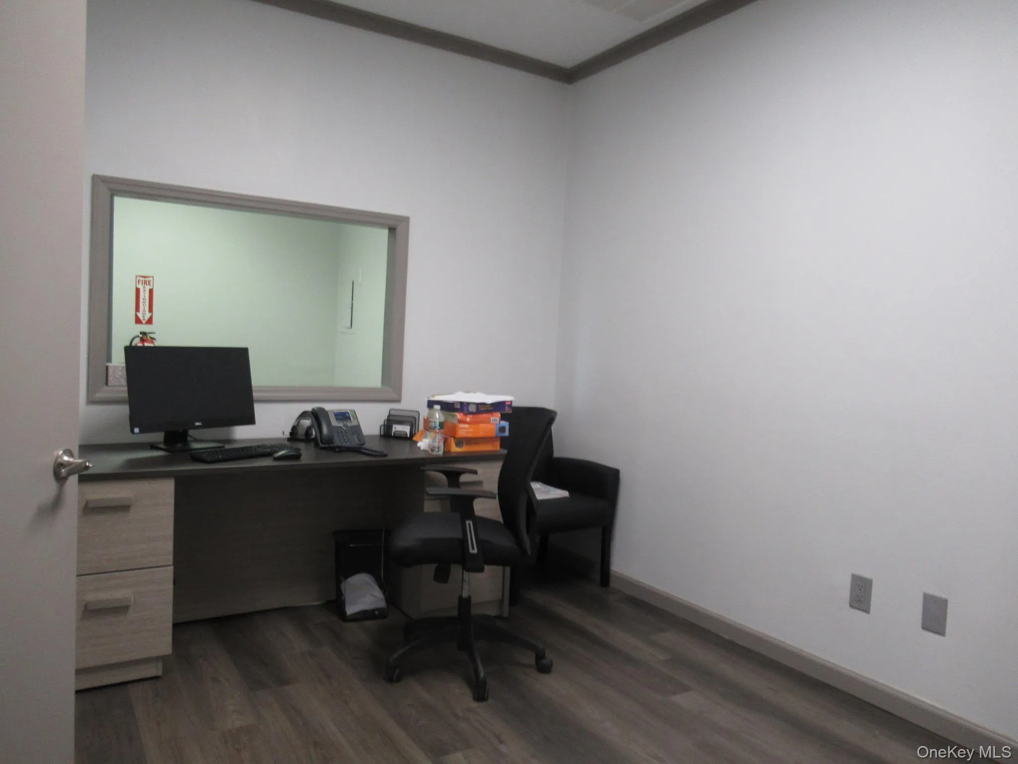 Home office with dark wood-style floors Home office with dark wood-style floors