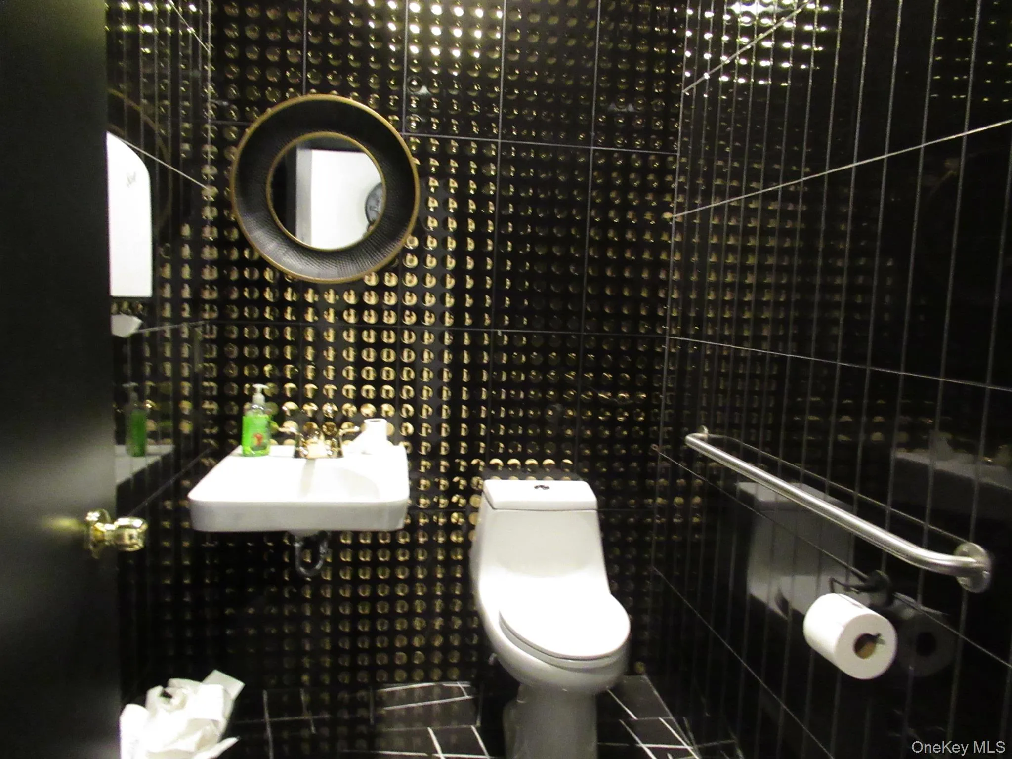 Half bathroom with toilet and a sink Half bathroom with toilet and a sink