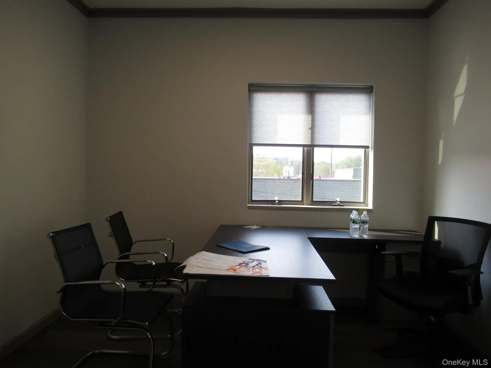 Home office featuring crown molding and dark wood-type flooring Home office featuring crown molding and dark wood-type flooring