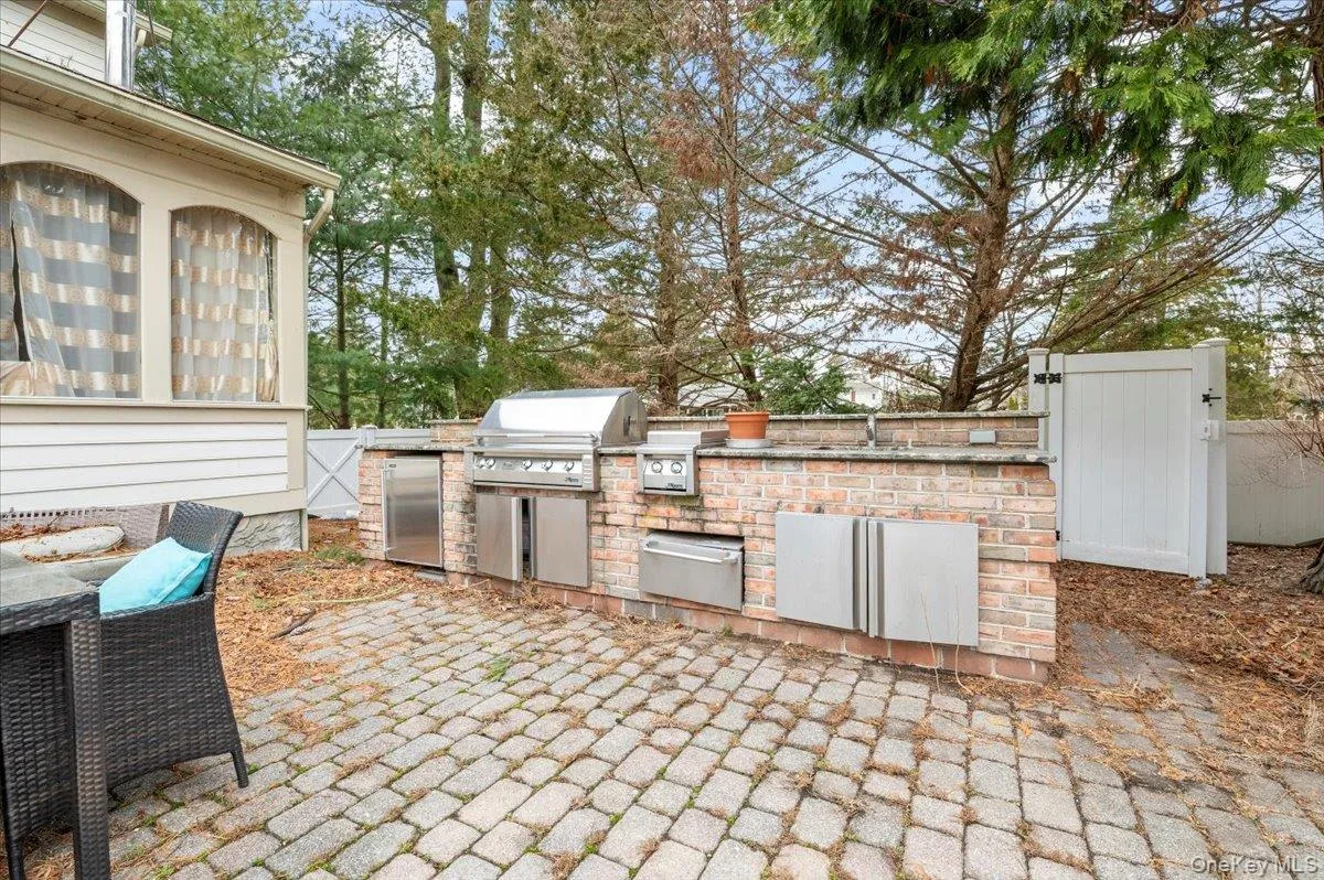 View of patio / terrace with an outdoor kitchen and a sink View of patio / terrace with an outdoor kitchen and a sink