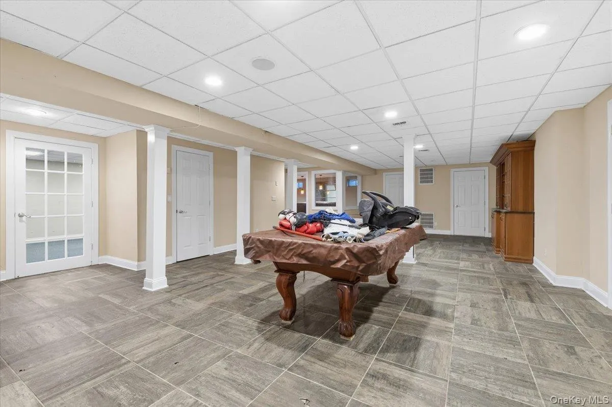 Basement Recreation room with recessed lighting, billiards table, and a paneled ceiling Basement Recreation room with recessed lighting, billiards table, and a paneled ceiling