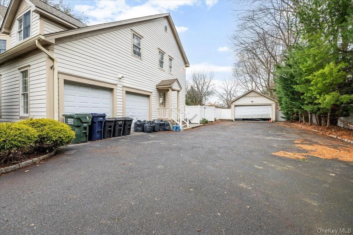 View of property exterior with a garage View of property exterior with a garage