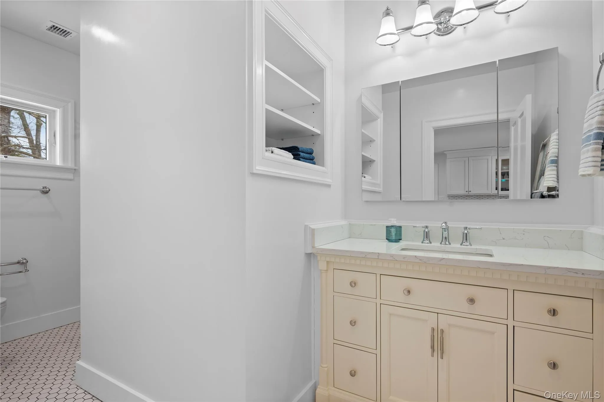 Bathroom featuring vanity and tile patterned floors Bathroom featuring vanity and tile patterned floors