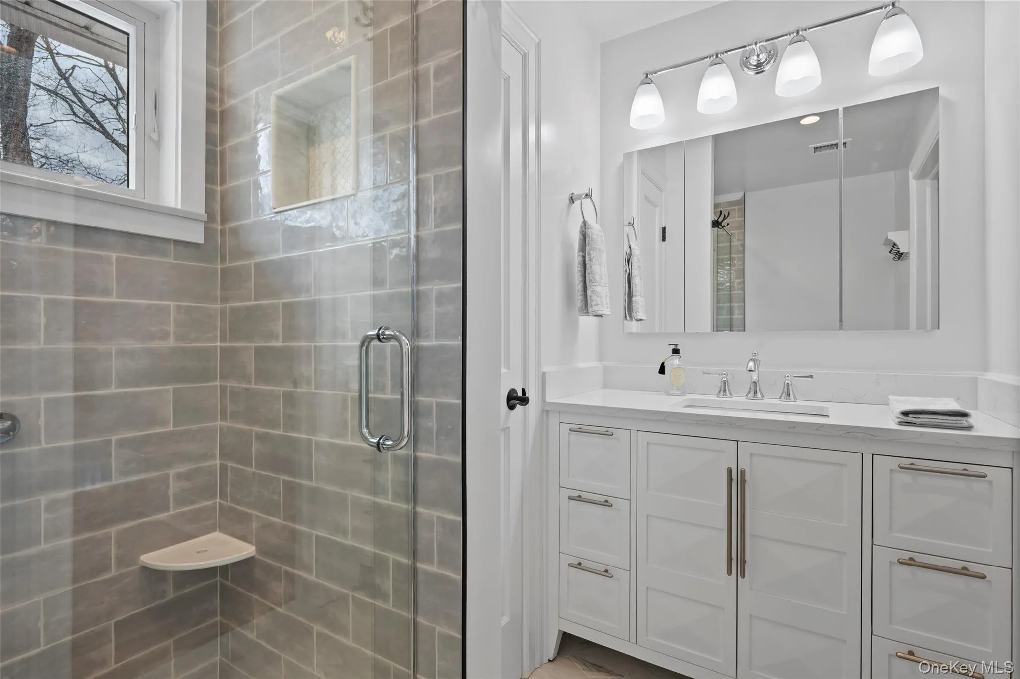 Full bathroom with vanity and a stall shower Full bathroom with vanity and a stall shower