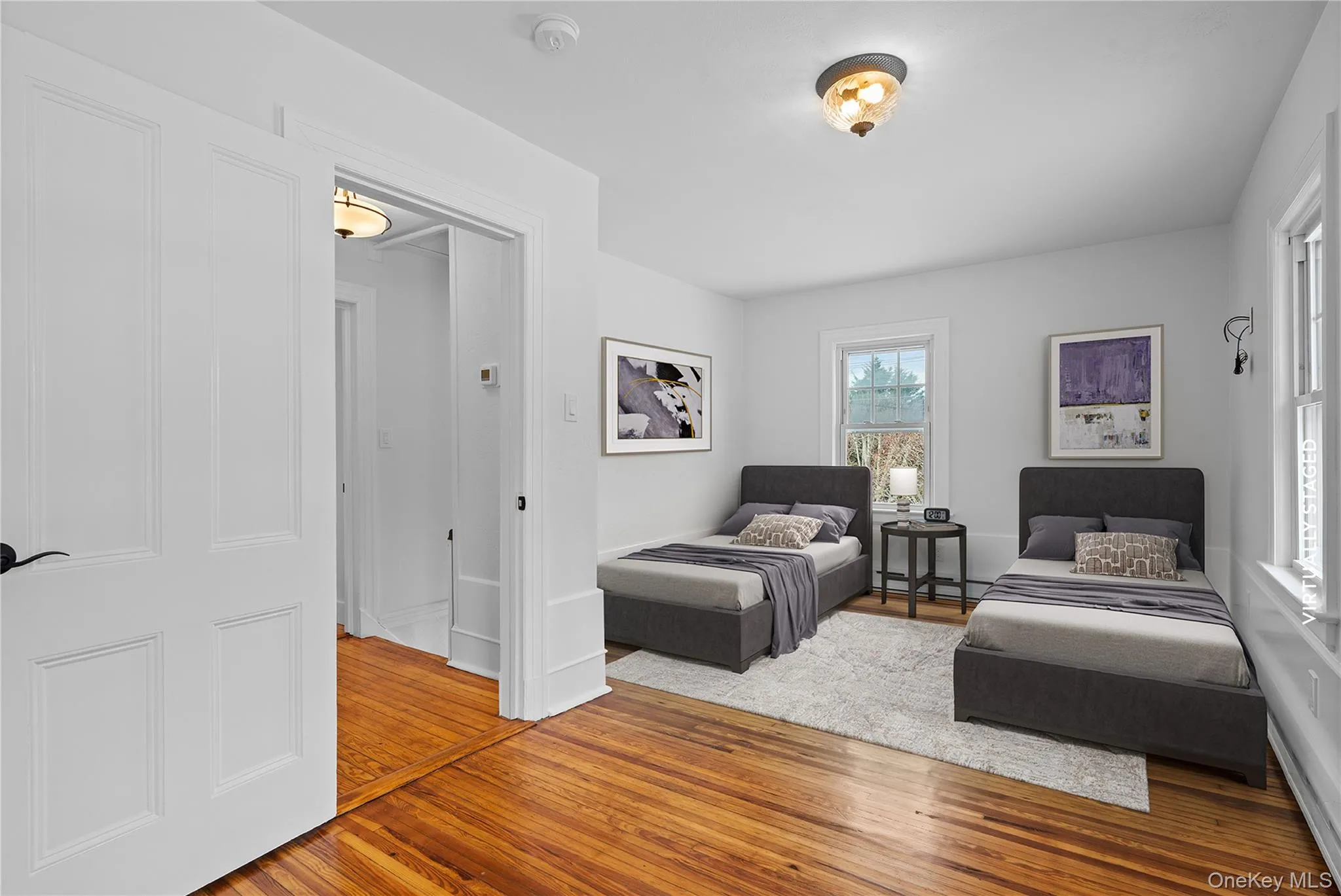 Bedroom with light wood-type flooring Bedroom with light wood-type flooring